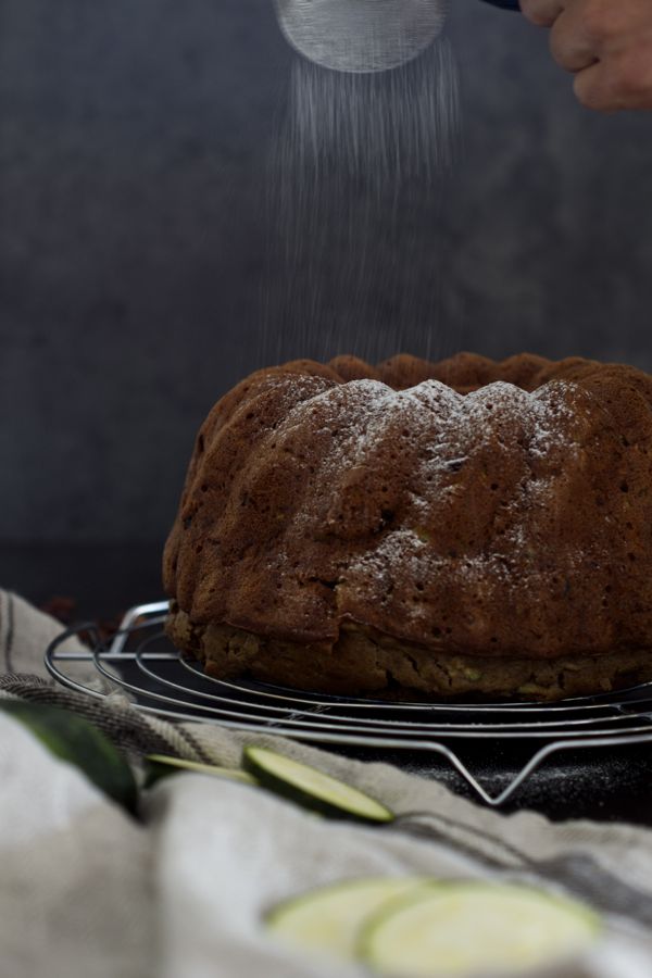 Healthy Zucchini Bundt Cake, being sugar dusted #healtyfats #walnuts #lowonsugar