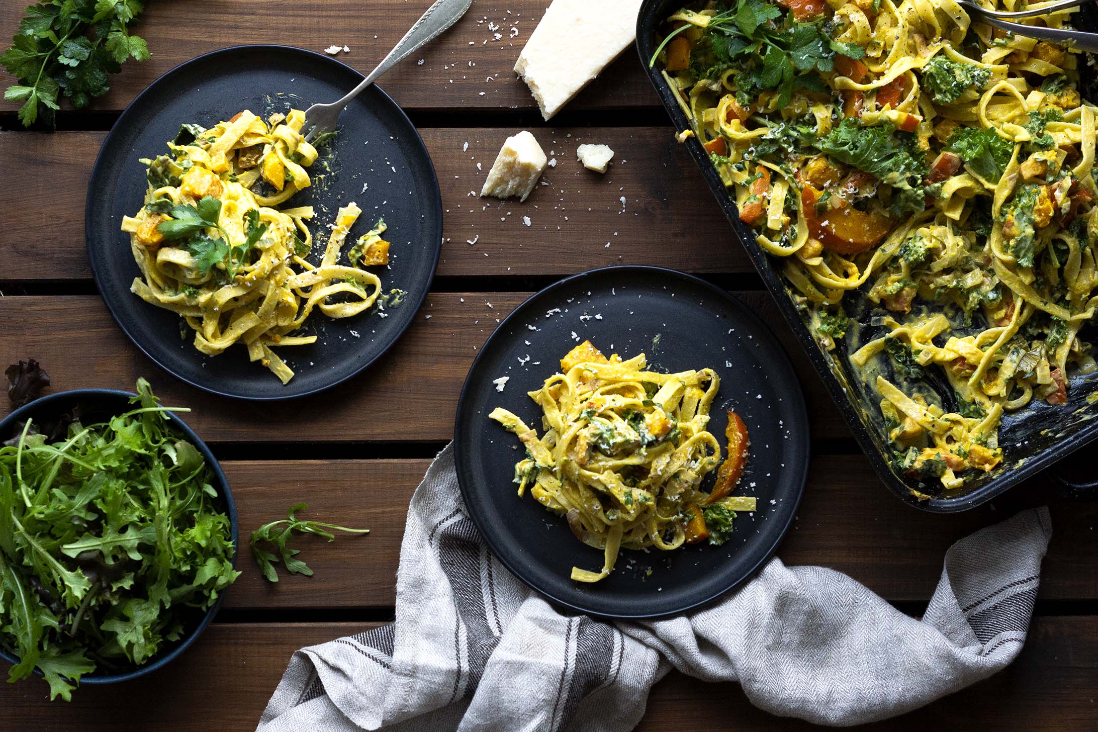 Roasted Hokkaido & Kale Fettuccine on two plates & in a baking dish