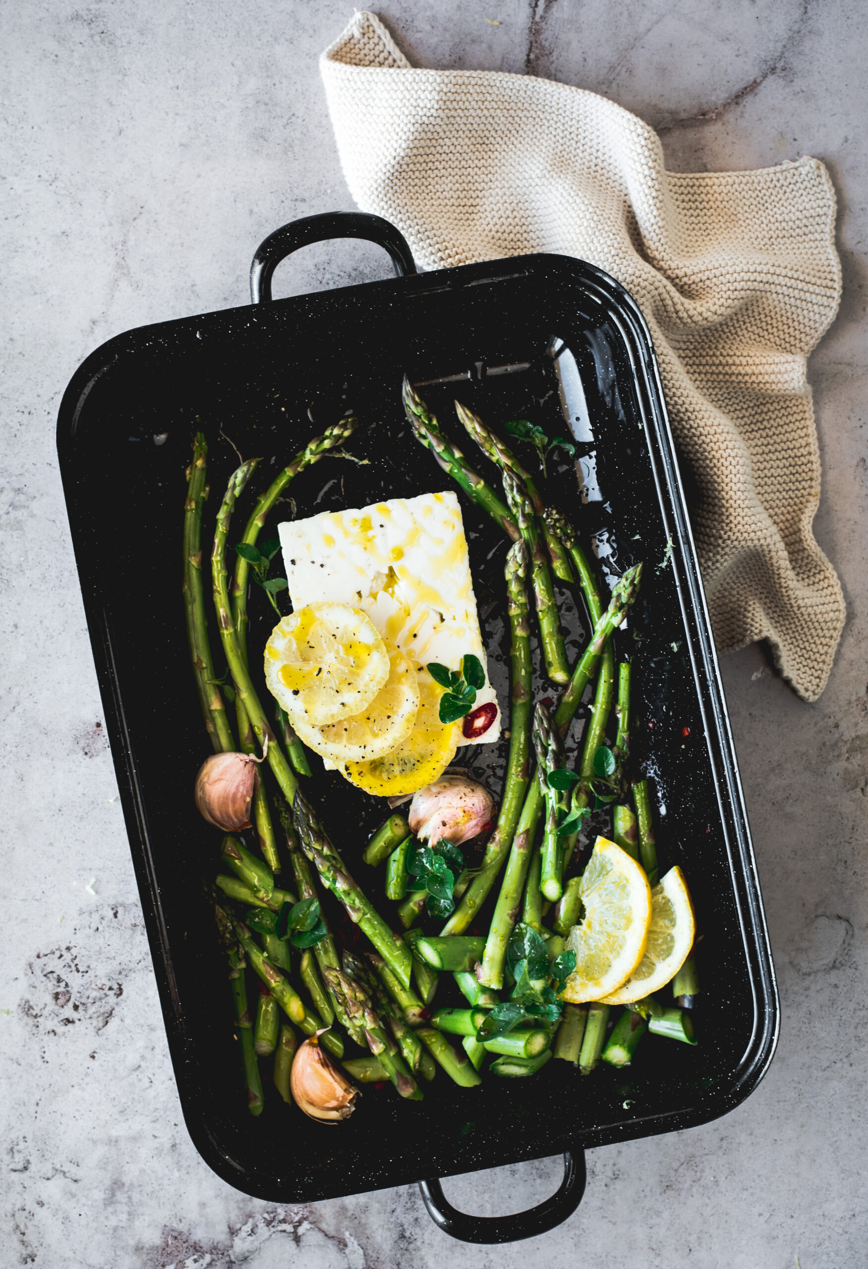 Baking dish with feta & green asparagus - food photo flatlay