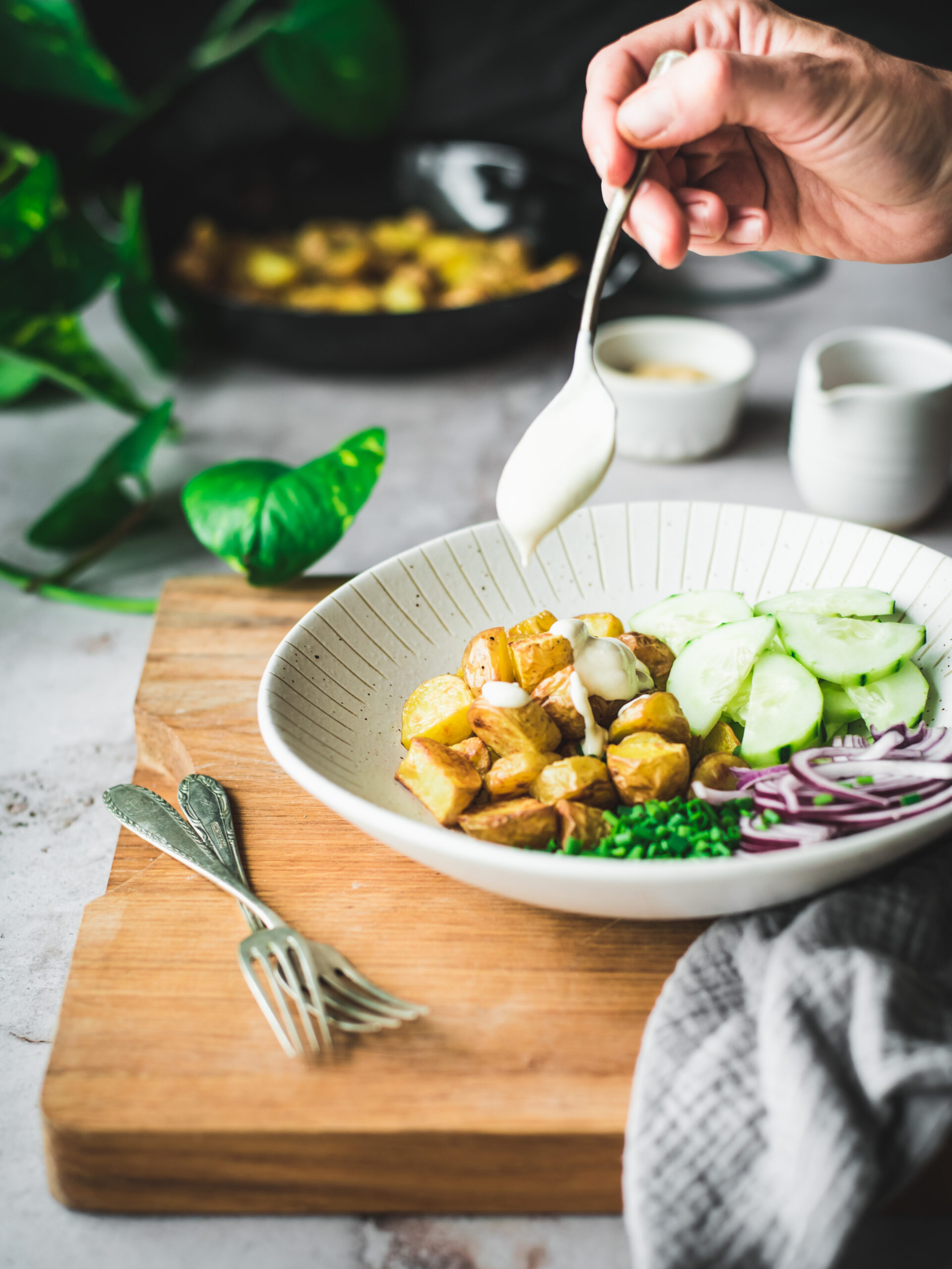 A simple roasted potato cucumber salad with greek yoghurt dressing