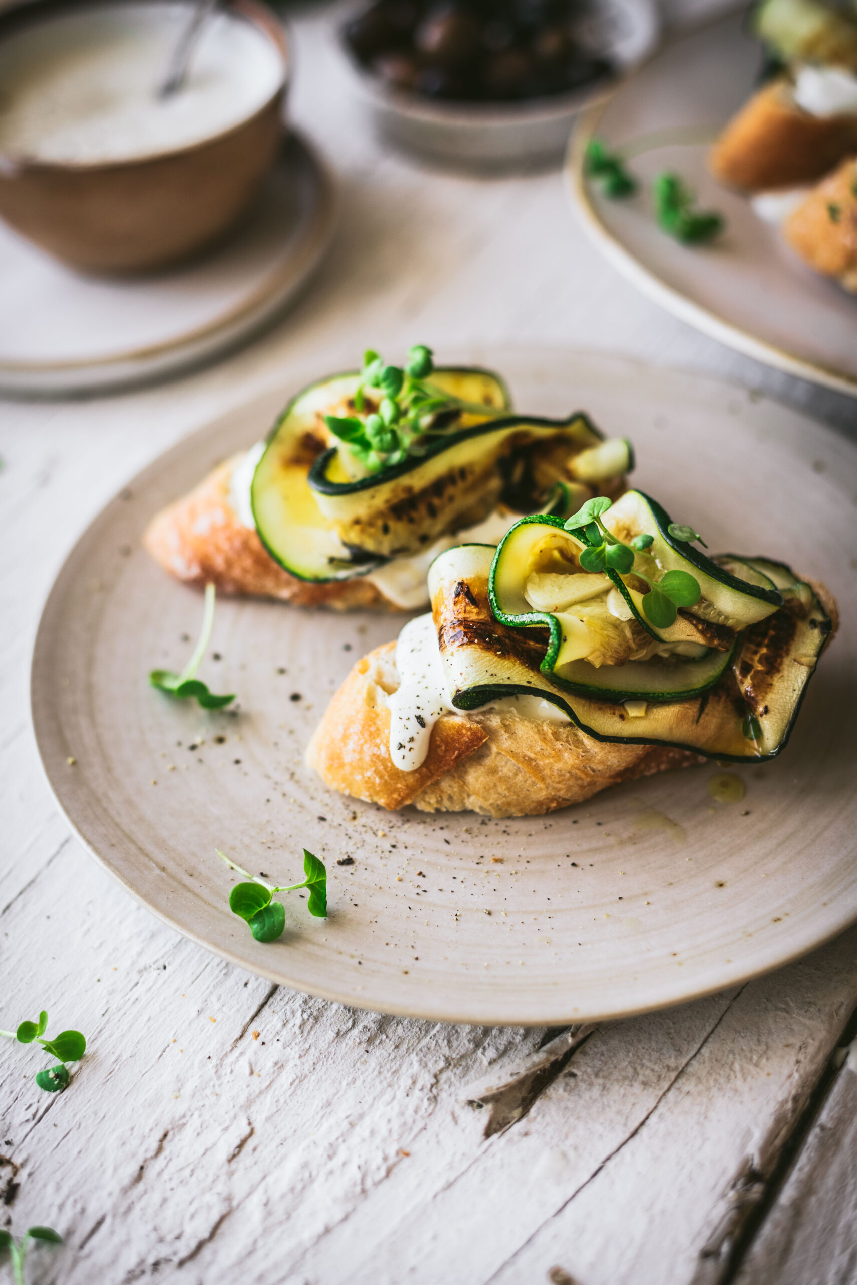 A crispy crostini topped with grilled, garlicky zucchini