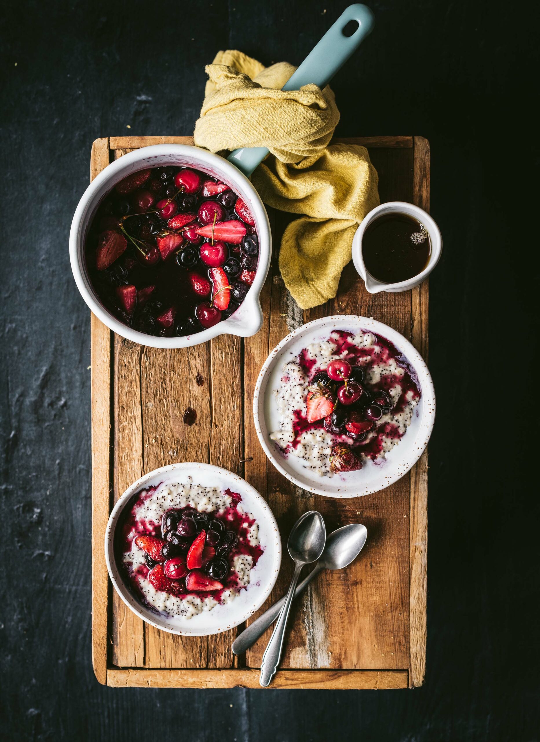 Creamy Amaranth Oat Porridge topped with freshly stewed summer berries