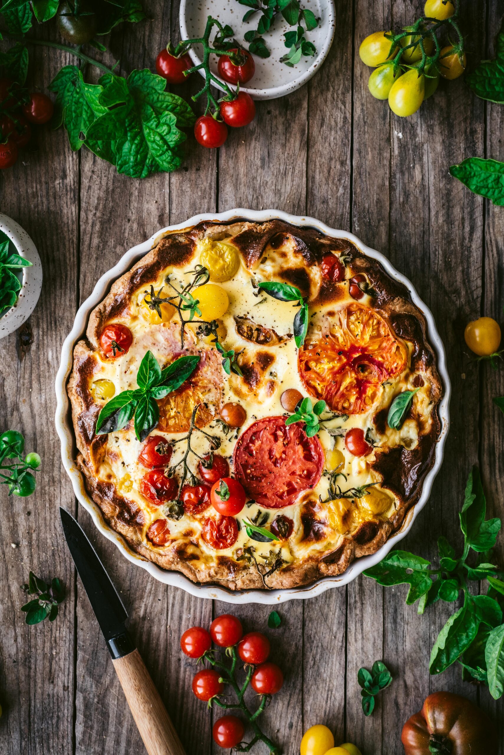 A crispy crusted summer quiche filled with heirloom tomatoes & mascarpone