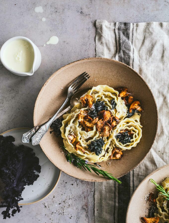 Showing a hollow plate with creamy chanterelle & kale pappardelle